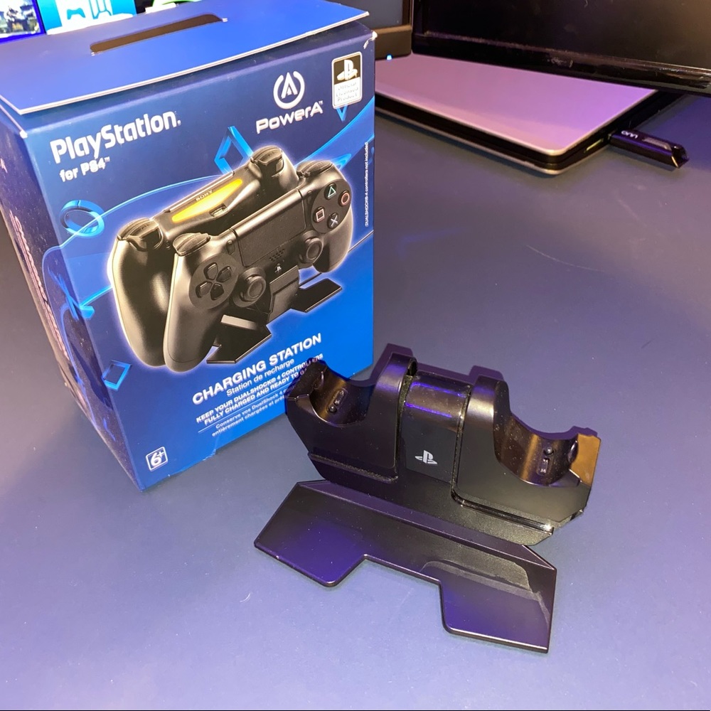 Playstation 4 controllers, games, and charging stand